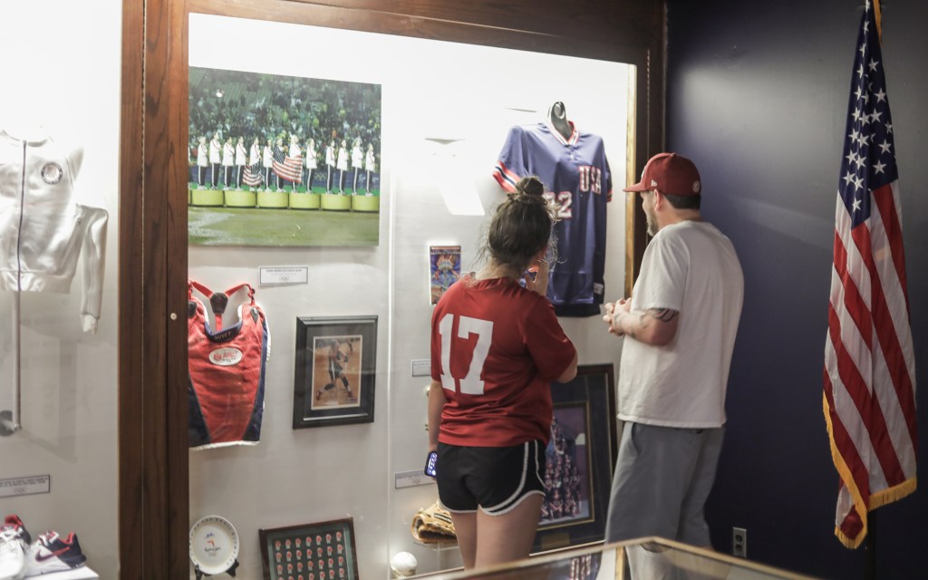 guests looking at exhibit at the National Softball Hall of Fame Museum