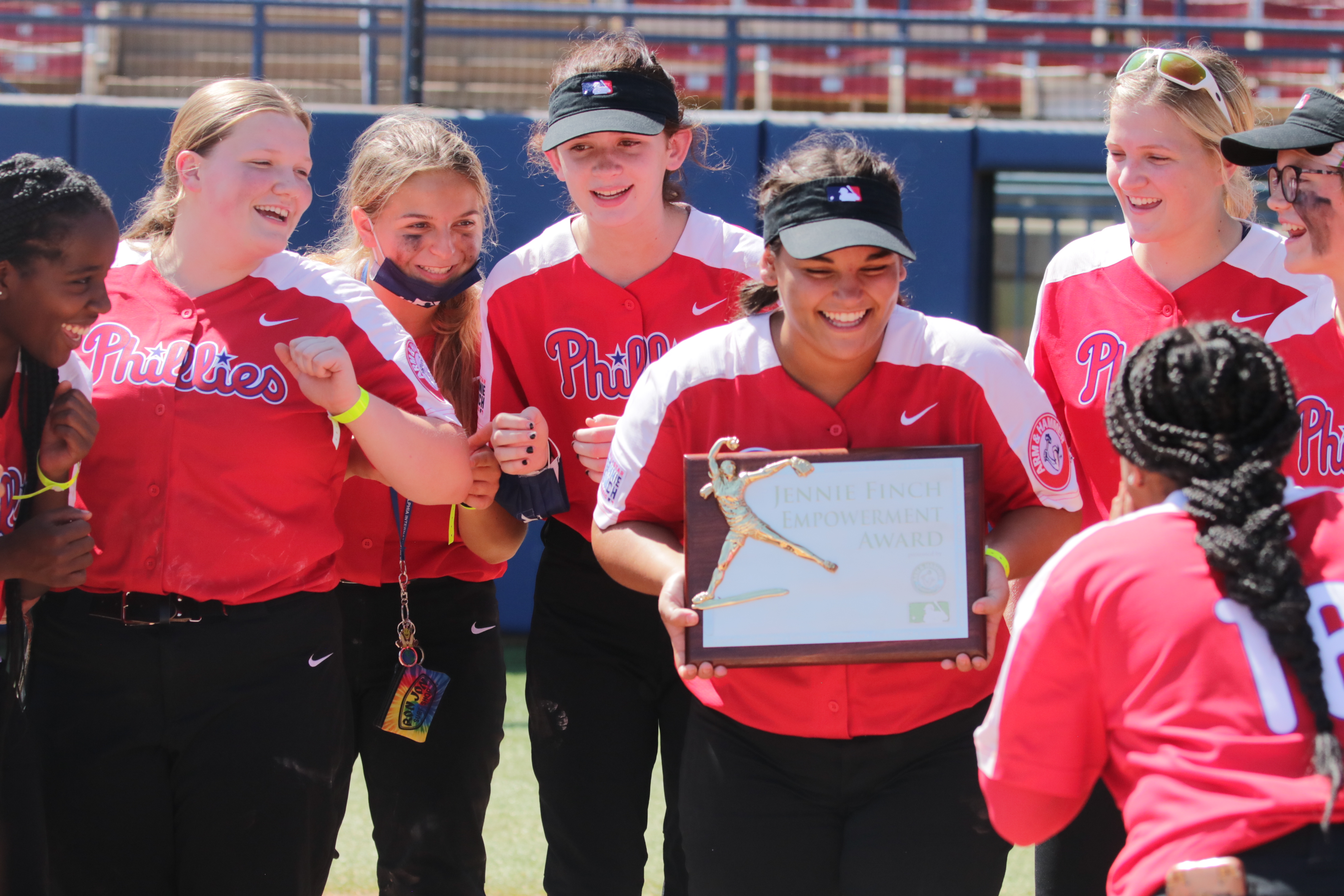 teammates celebrating player receiving award