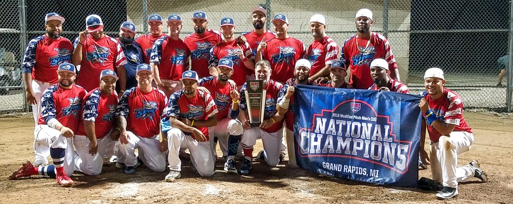 softball men's team with national champions banner