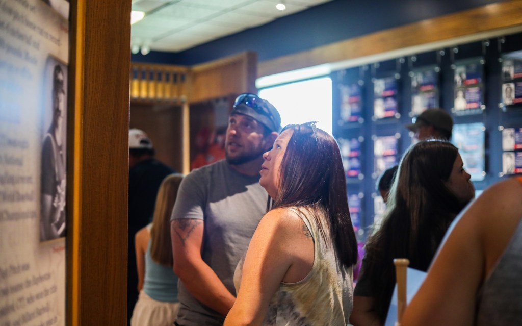 guests looking at exhibit at the National Softball Hall of Fame Museum