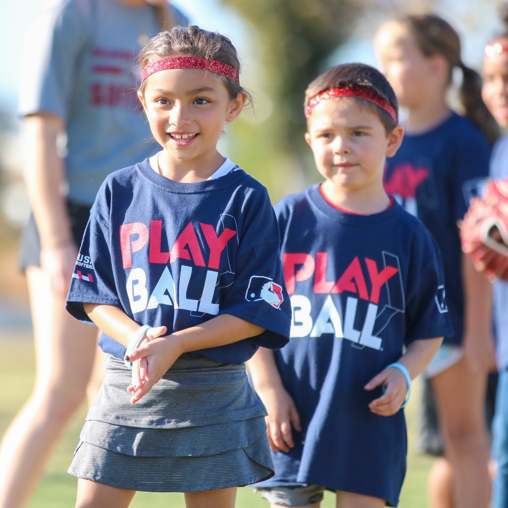 junior player wearing a PlayBall t-shirt